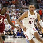 Auburn forward Jabari Smith (10) goes to the basket pas South Carolina forward Keyshawn Bryant (24) during the second half of an NCAA college basketball game Saturday, March 5, 2022, in Auburn, Ala.