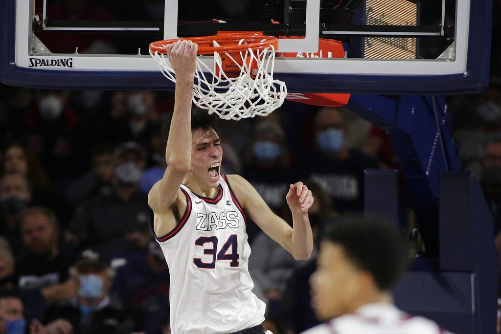 Gonzaga center Chet Holmgren reacts after his dunk during the first half of an NCAA college basketball game against Bellarmine, Friday, Nov. 19, 2021, in Spokane, Wash.