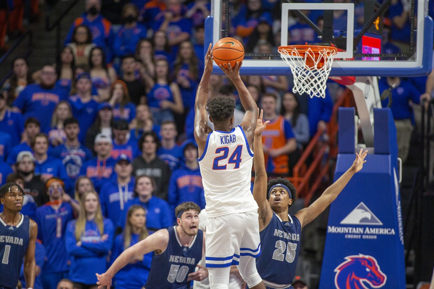 Mar 1, 2022; Boise, Idaho, USA; Boise State Broncos forward Abu Kigab (24) shoots a thee point shot during first half against the Nevada Wolf Pack at ExtraMile Arena.