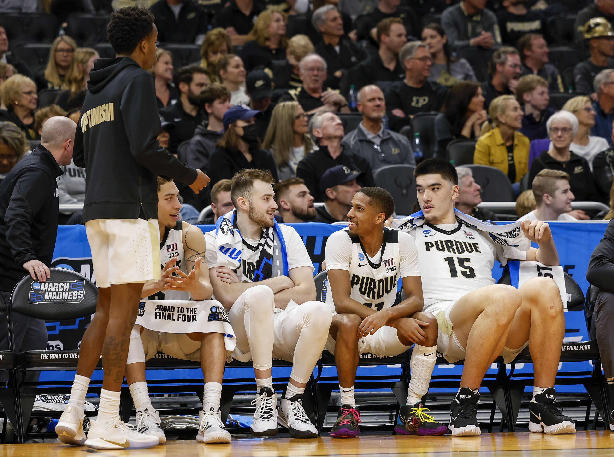 Purdue Boilermakers guard Sasha Stefanovic (55) and guard Isaiah Thompson (11) and center Zach Edey (15) talk on the bench during the second half against the Yale Bulldogs in the first round of the 2022 NCAA Tournament