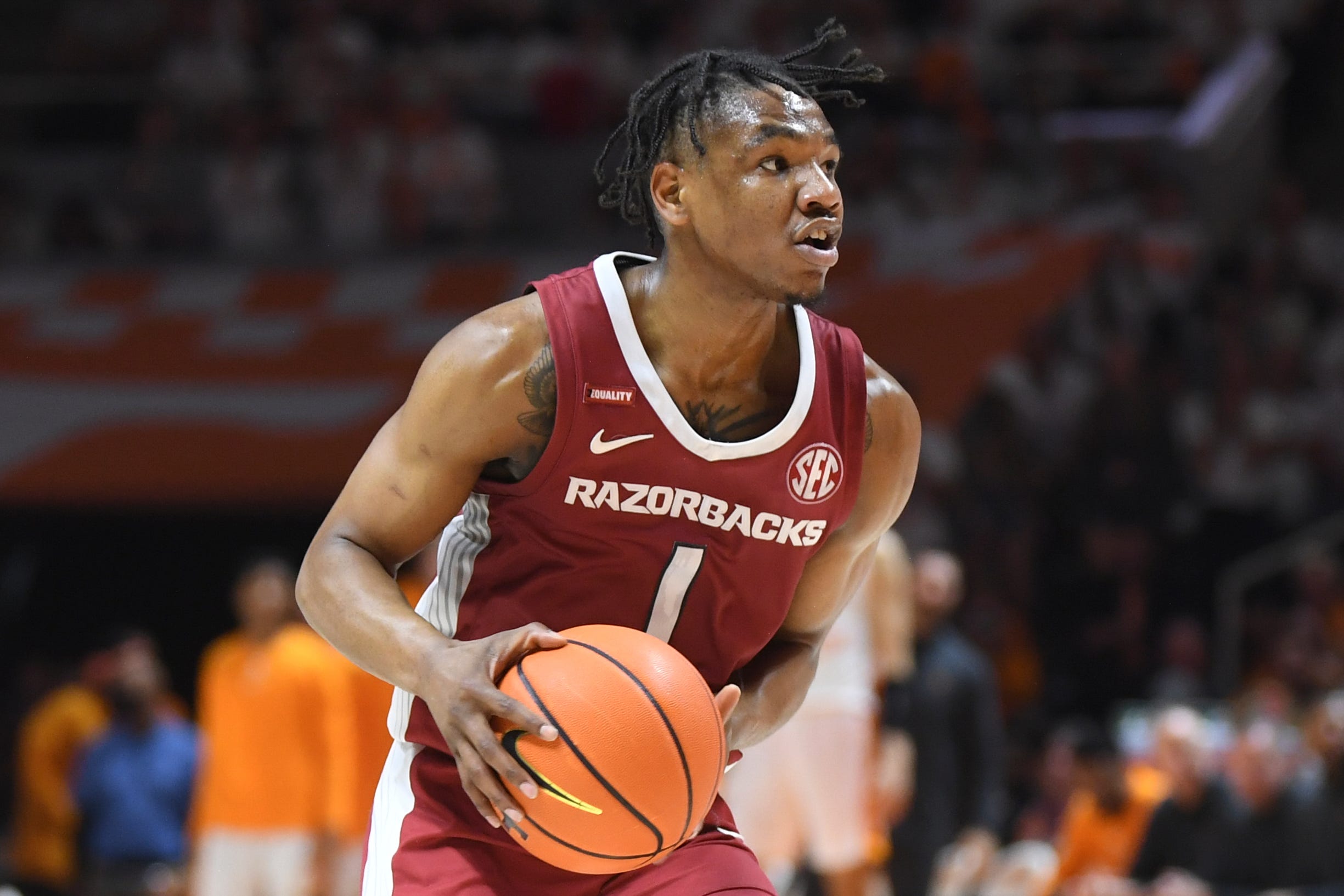 Arkansas guard JD Notae (1) dribbles the ball during the final regular season game between Tennessee and Arkansas at Thompson-Boling Arena in Knoxville, Tenn., Saturday, March 5, 2022