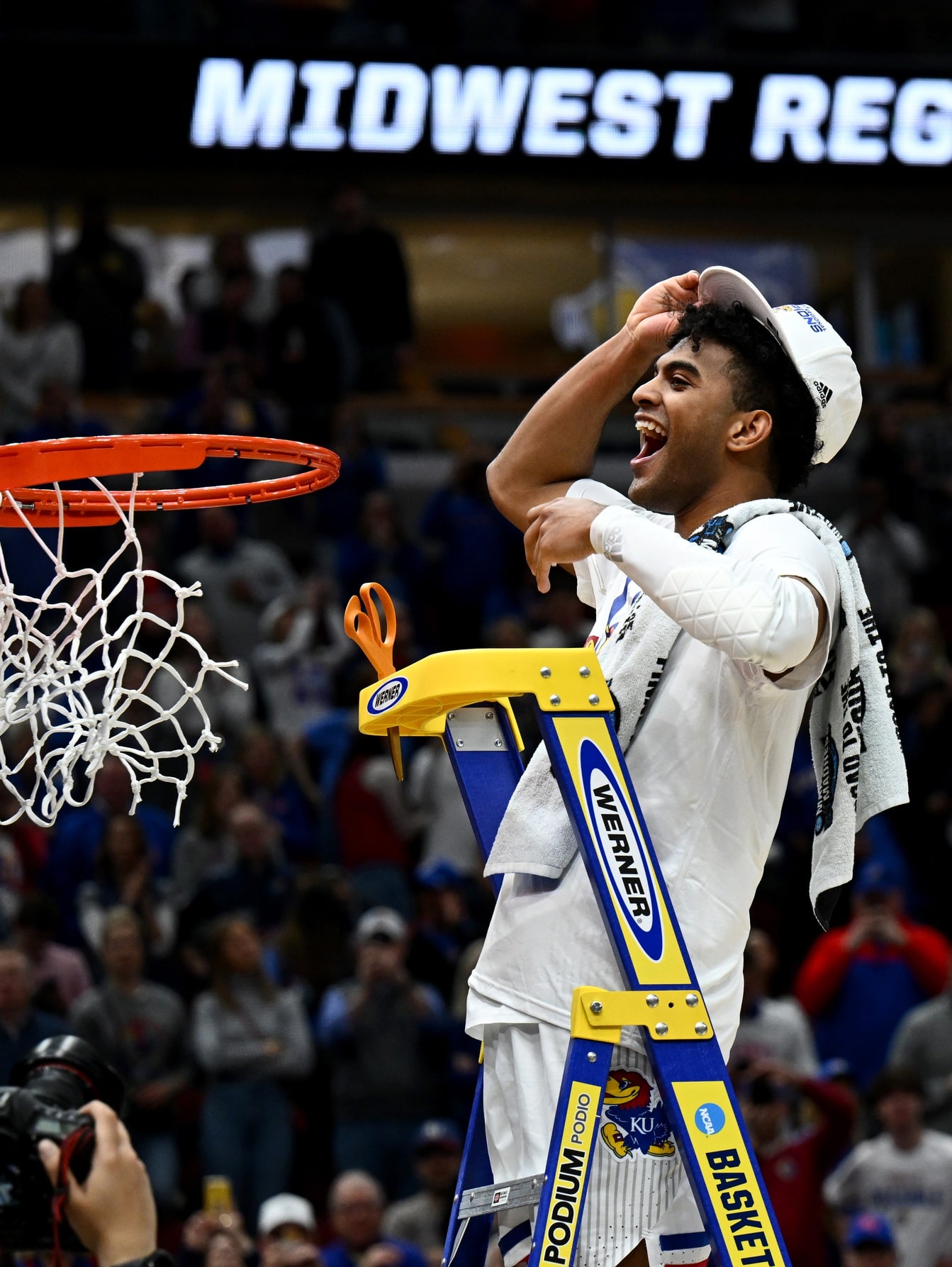 Mar 27, 2022; Chicago, IL, USA; Kansas Jayhawks guard Remy Martin (11) cuts down the nets after advancing to the Final Four by defeating the Miami Hurricanes 76-50 in the finals of the Midwest regional of the men's college basketball NCAA Tournament at United Center.
