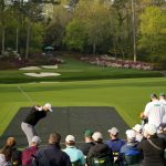 Jon Rahm tees off on no. 12 during a practice round of The Masters golf tournament at Augusta National Golf Club.