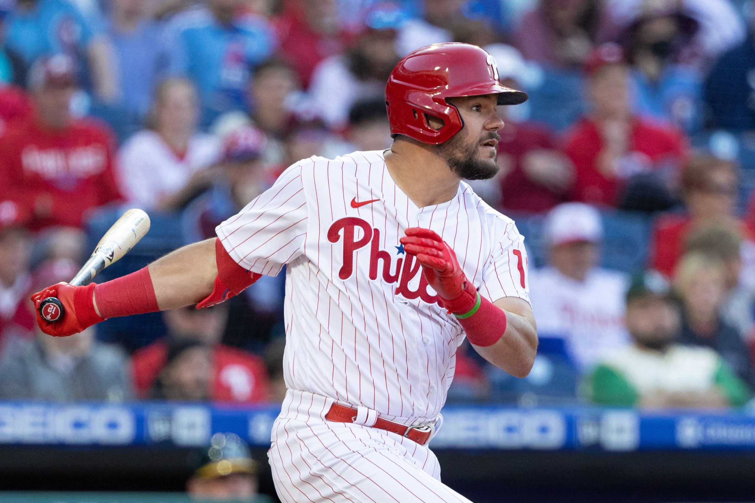 Philadelphia Phillies left fielder Kyle Schwarber (12) hits an RBI single during the eighth inning against the Oakland Athletics at Citizens Bank Park.