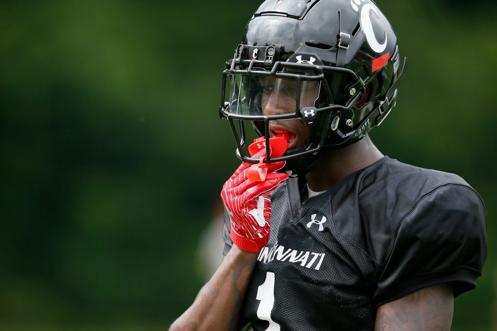 Cincinnati Bearcats cornerback Ahmad Gardner (1) resets between plays during practice at the Higher Ground training facility in West Harrison, Ind., on Monday, Aug. 9, 2021