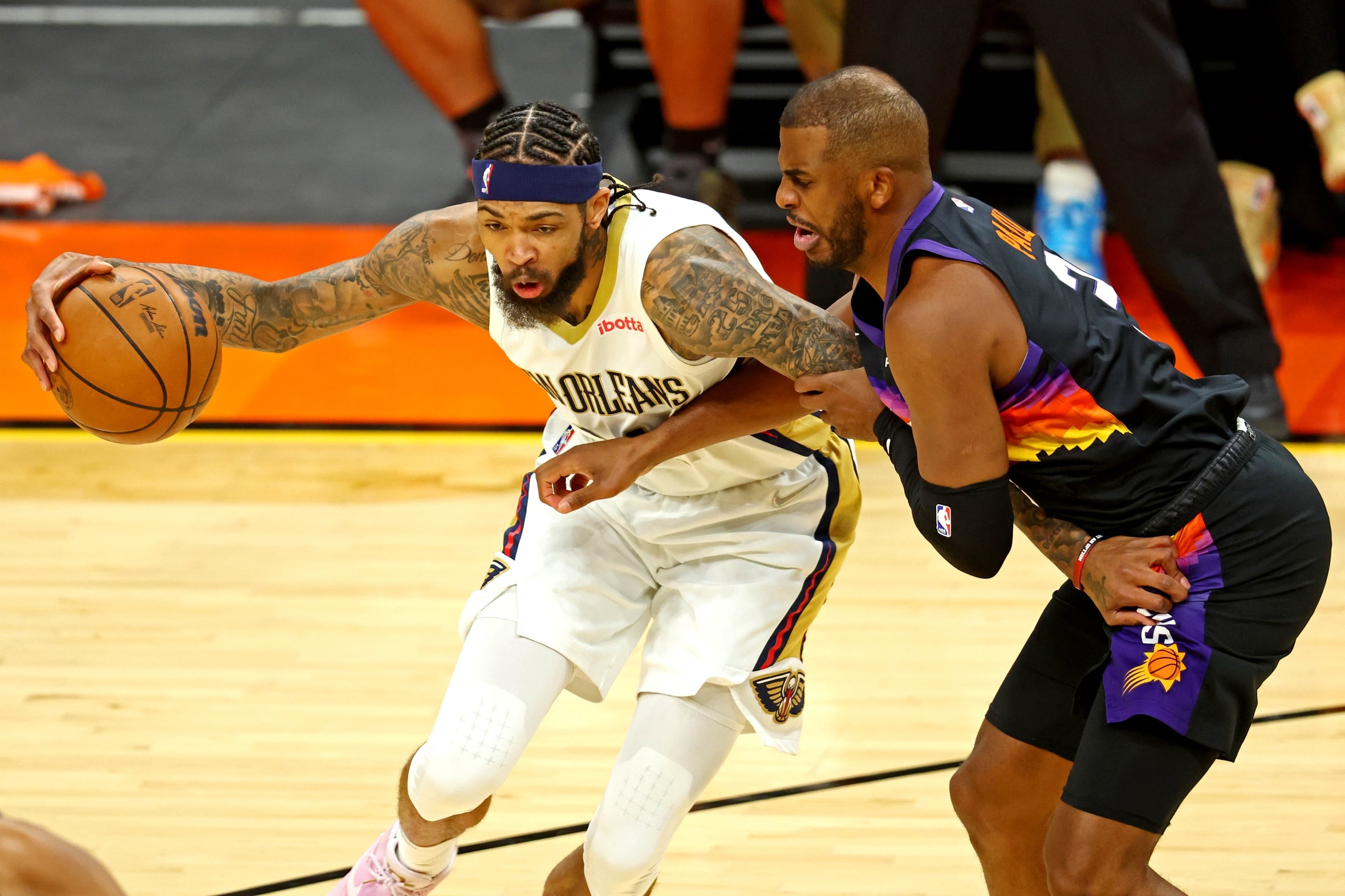 New Orleans Pelicans forward Brandon Ingram (14) drives to the basket against Phoenix Suns guard Chris Paul (3) during the first quarter during game two of the first round for the 2022 NBA playoffs.