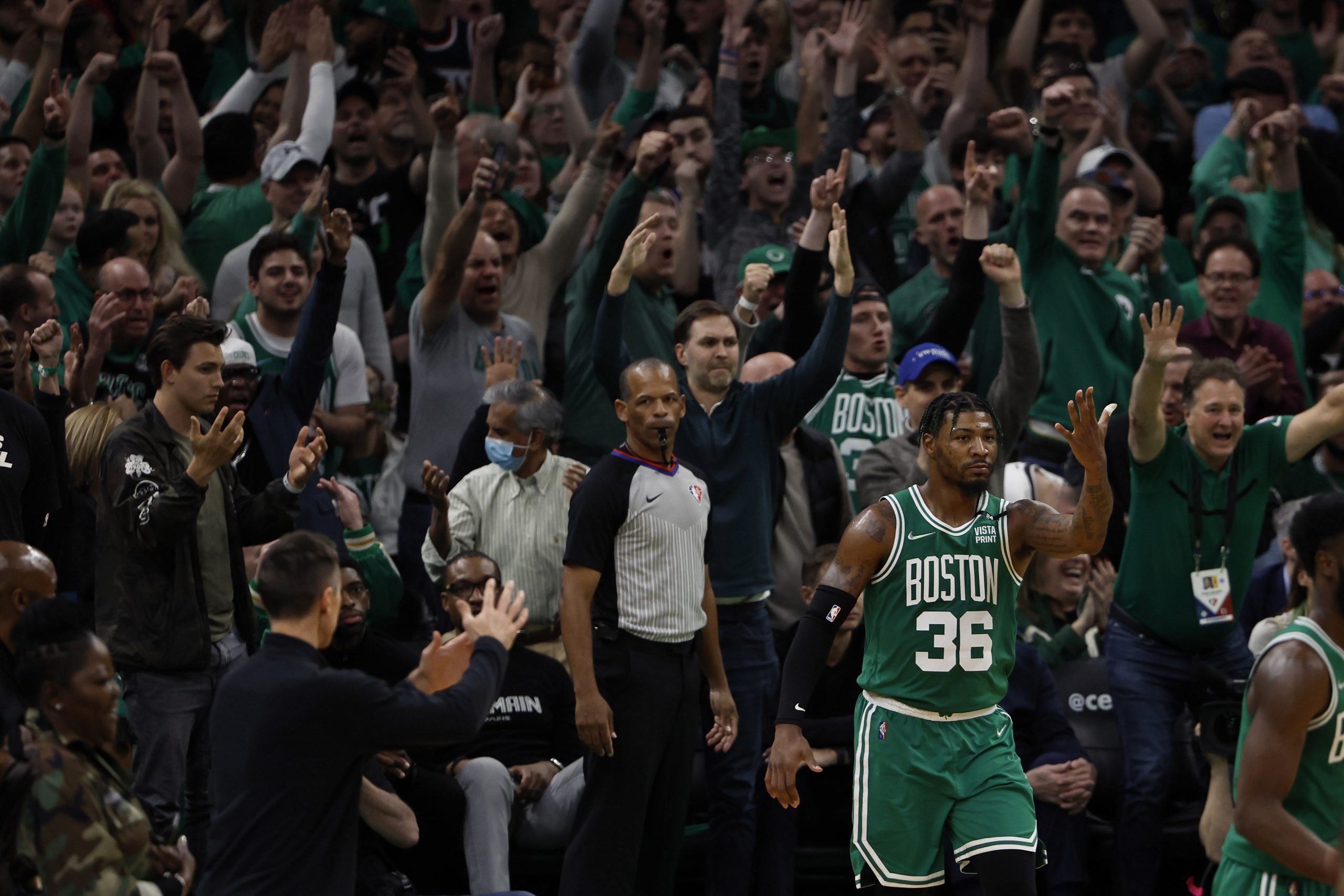 Fans cheer after Boston Celtics guard Marcus Smart (36) made a three point basket as Brooklyn Nets head coach Steve Nash (left) calls timeout during the fourth quarter of game two of the first round of the 2022 NBA playoffs at TD Garden