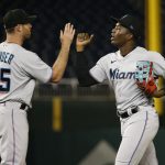 Miami Marlins center fielder Jesus Sanchez (7) celebrates with Miami Marlins relief pitcher Anthony Bender (55) after defeating the Washington Nationals at Nationals Park.