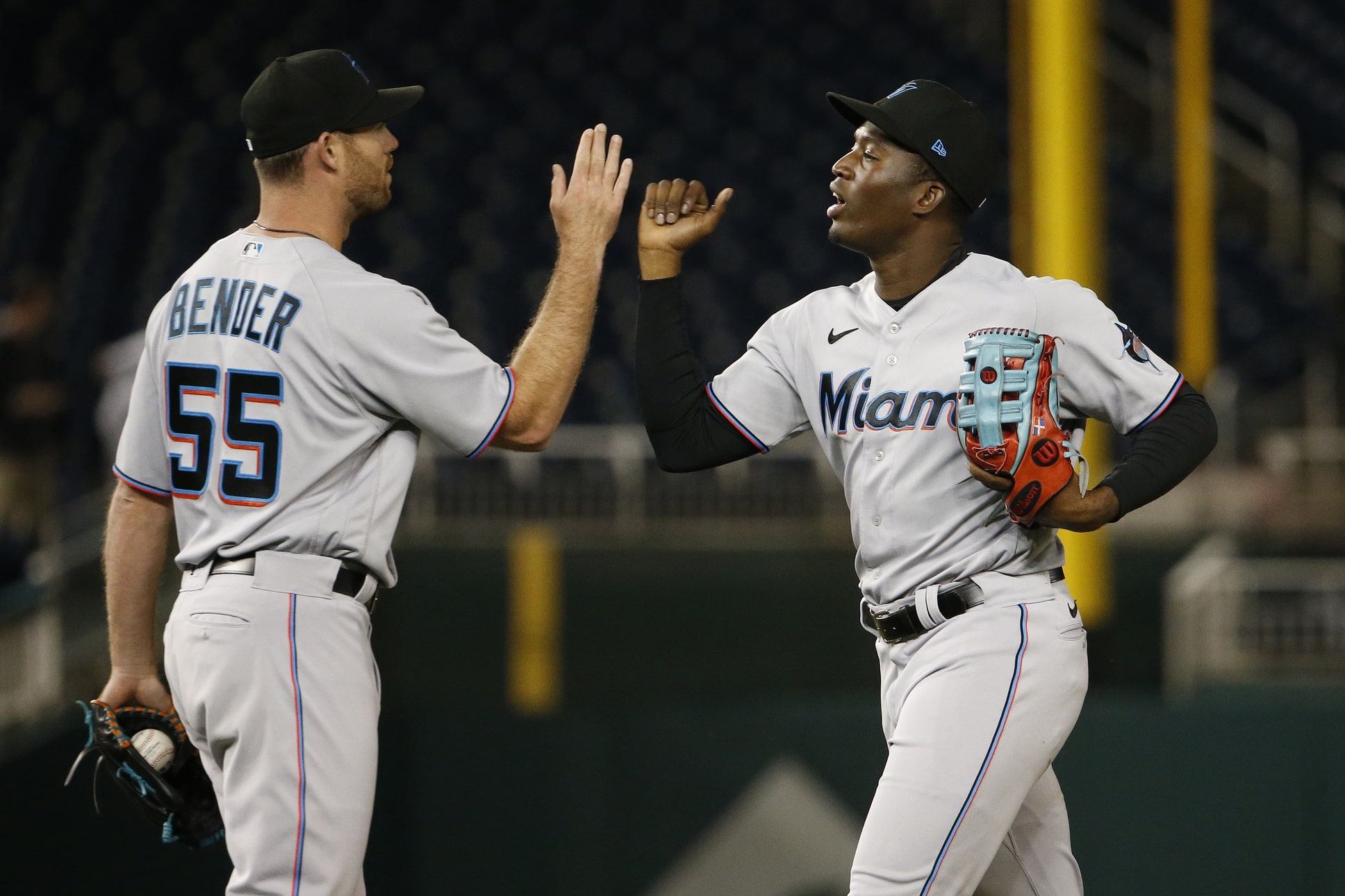 Miami Marlins center fielder Jesus Sanchez (7) celebrates with Miami Marlins relief pitcher Anthony Bender (55) after defeating the Washington Nationals at Nationals Park.