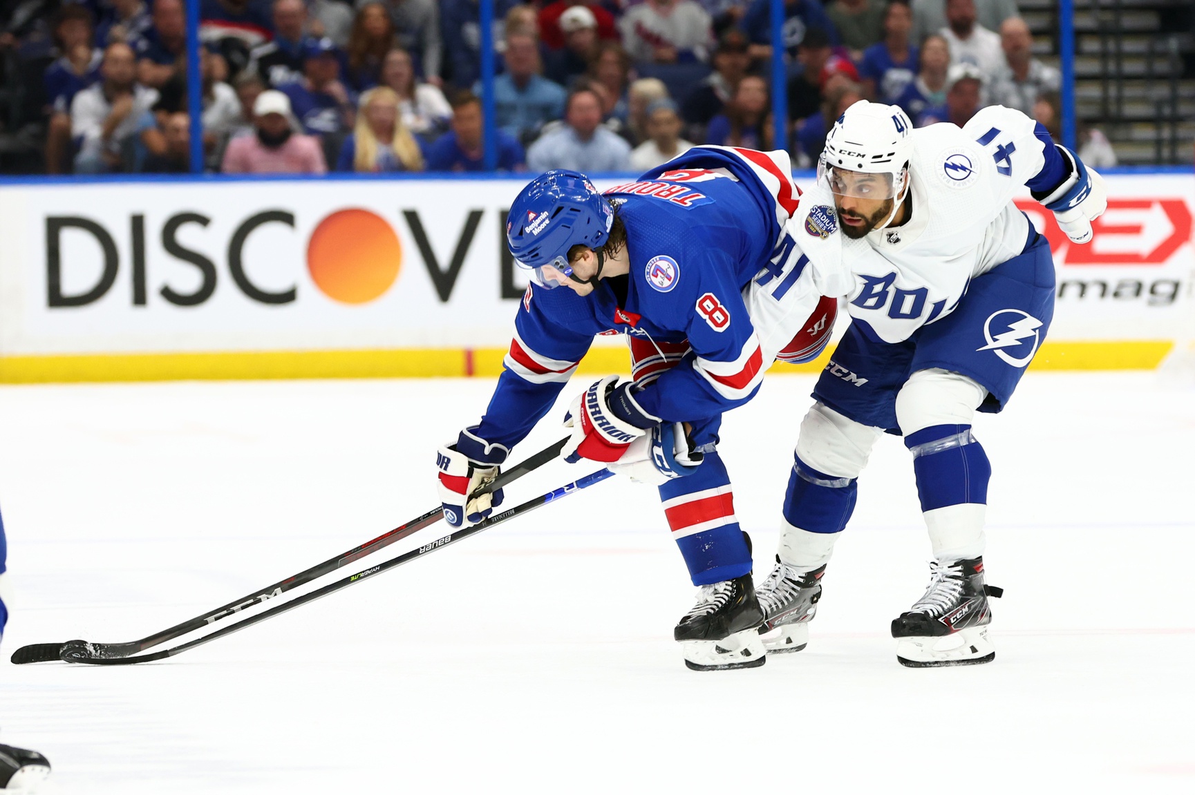 Tampa Bay Lightning left wing Pierre-Edouard Bellemare (41) battles for the puck against New York Rangers defenseman Jacob Trouba (8) during the third period at Amalie Arena.