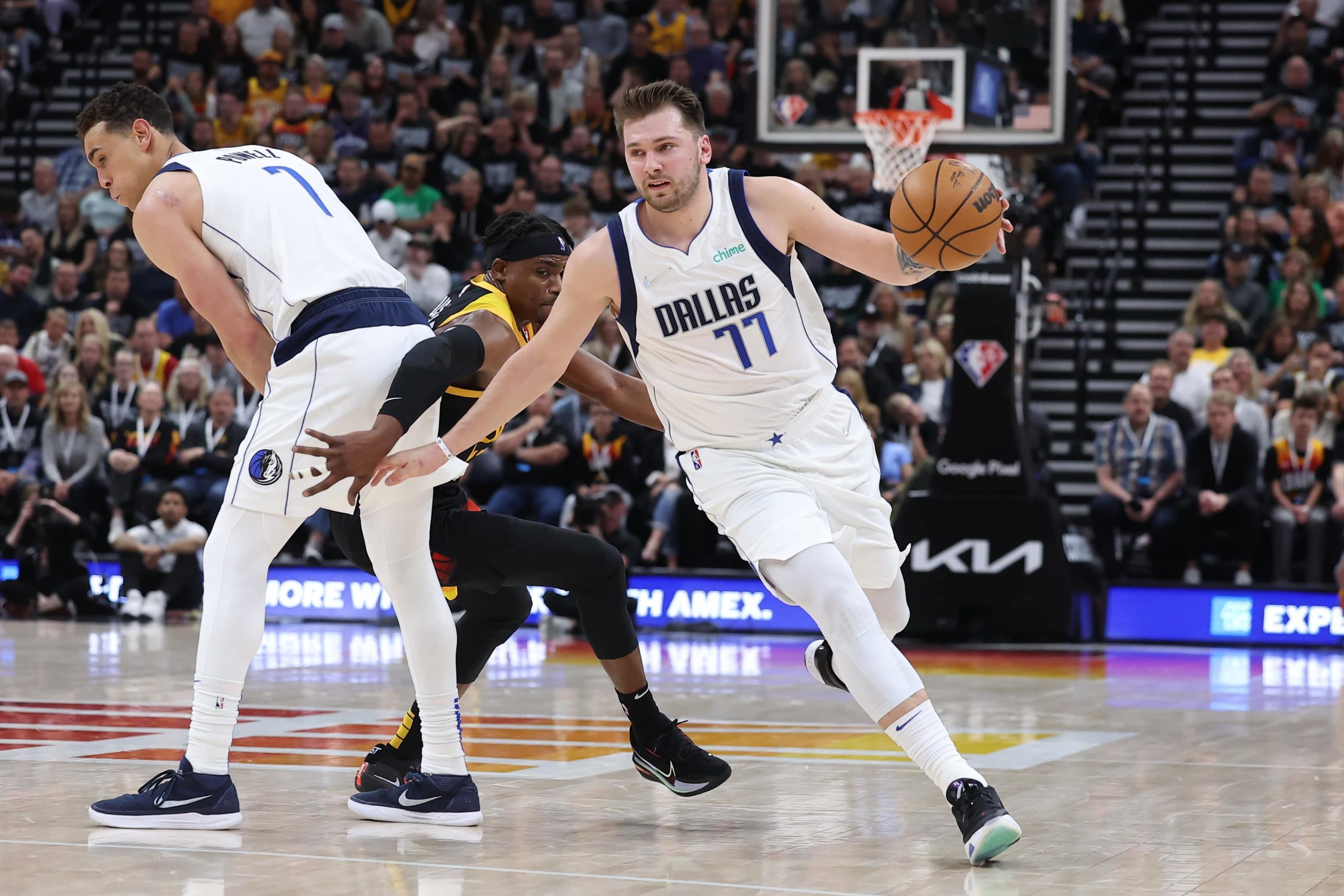 Dallas Mavericks guard Luka Doncic (77) uses a screen by center Dwight Powell (7) to get past Utah Jazz Danuel House Jr. (25) in the second quarter during game six of the first round for the 2022 NBA