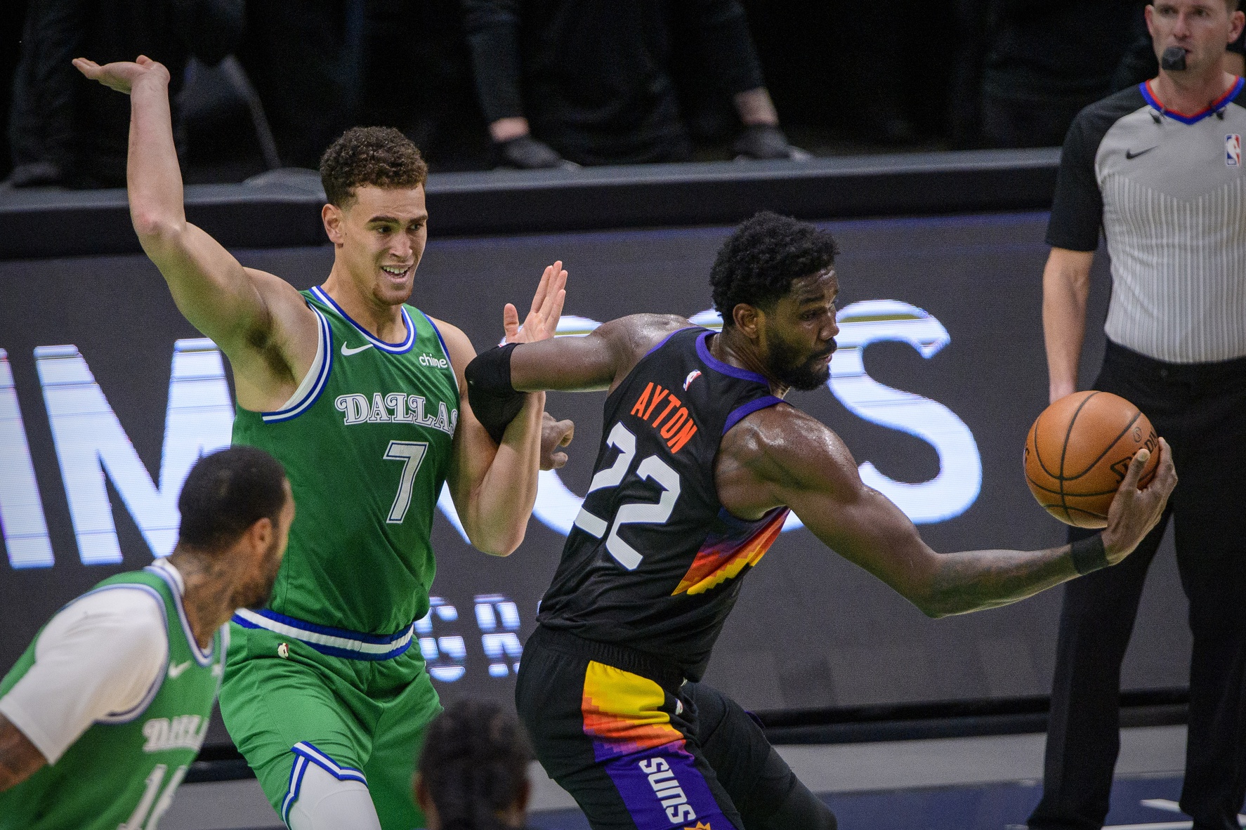 Phoenix Suns center Deandre Ayton (22) grabs a rebound in front of Dallas Mavericks center Dwight Powell (7) during the second half at the American Airlines Center.