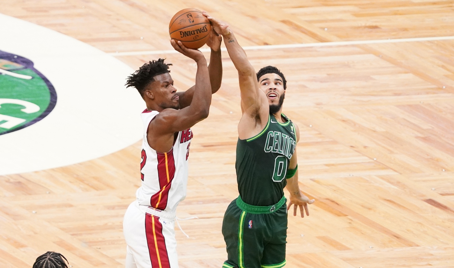 Boston Celtics forward Jayson Tatum (0) blocks the shot of Miami Heat forward Jimmy Butler (22) in the first quarter at TD Garden.