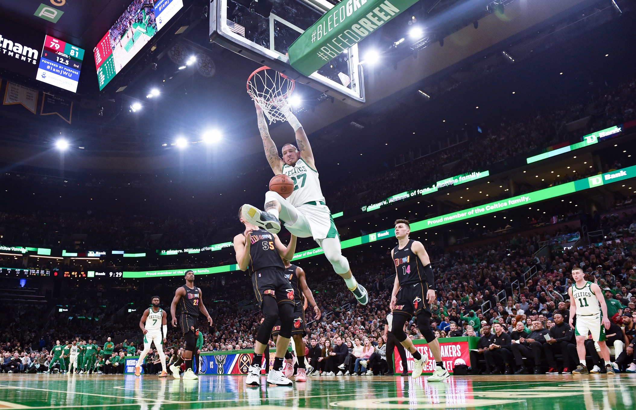 Boston Celtics center Daniel Theis (27) dunks the ball past Miami Heat guard Duncan Robinson (55) during the second half at TD Garden.
