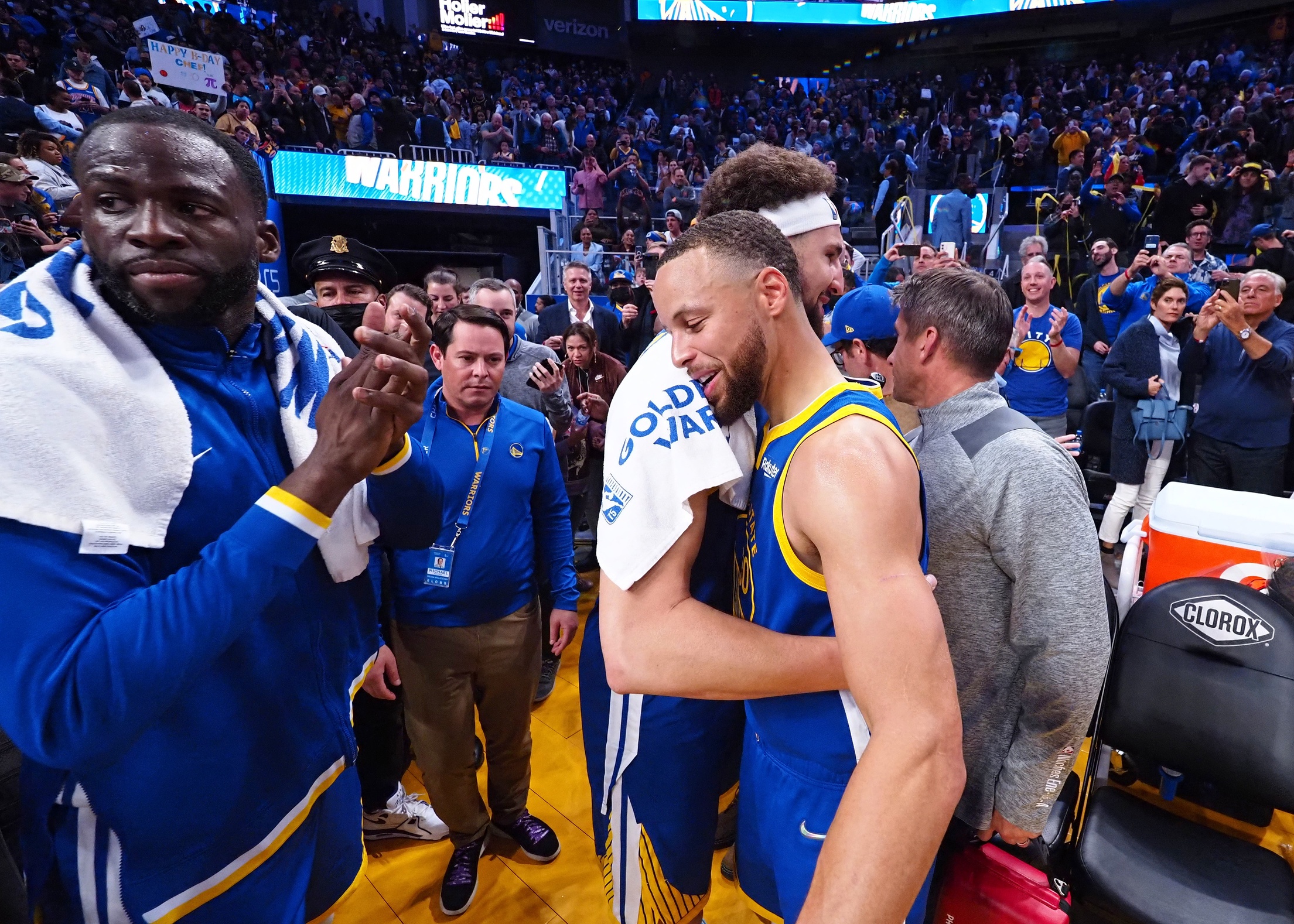 Golden State Warriors guard Stephen Curry (30) hugs guard Klay Thompson (11) with Golden State Warriors forward Draymond Green (23) after the game against the Washington Wizards at Chase Center.