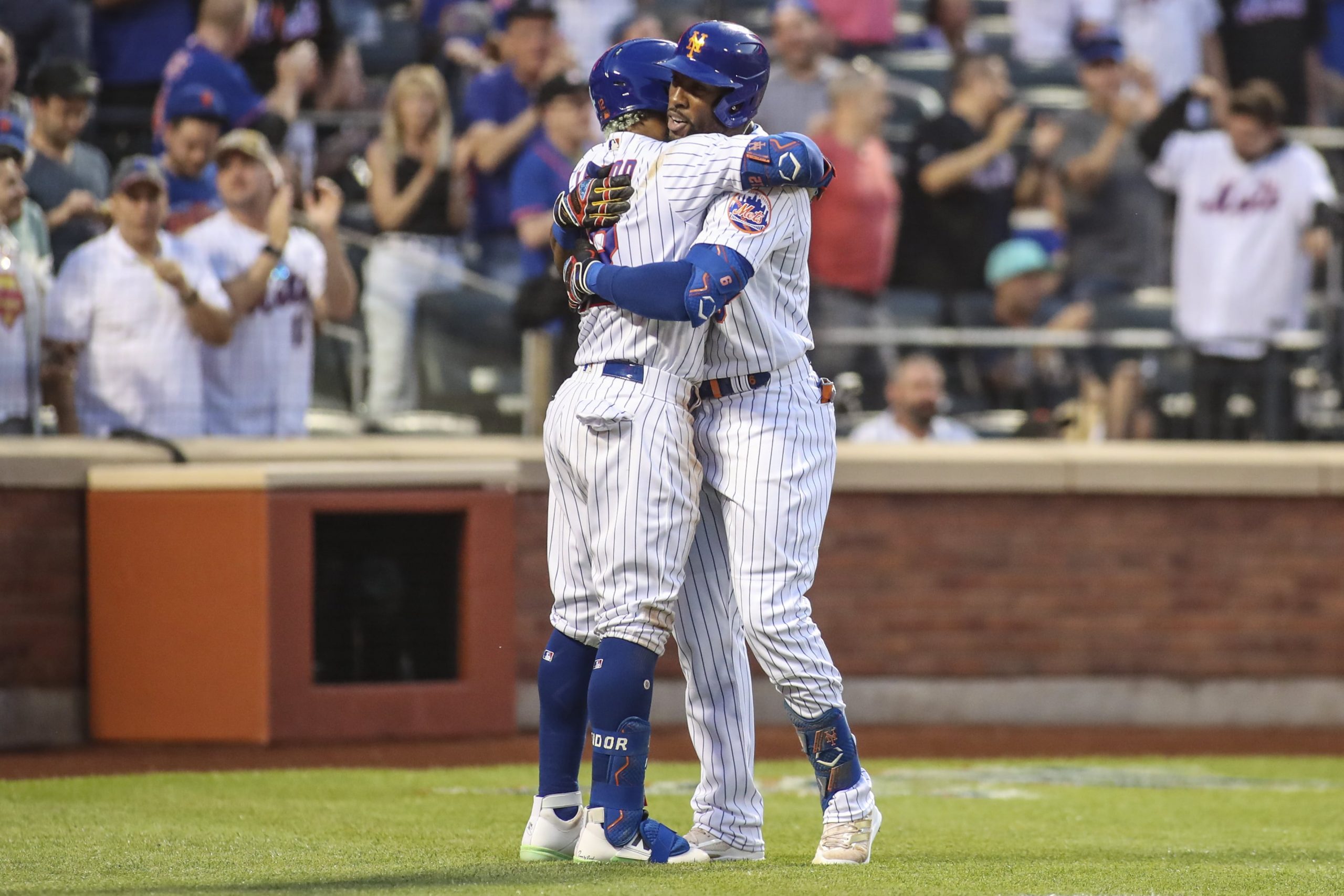 New York Mets right fielder Starling Marte (right) is hugged by shortstop Fransisco Lindor (left) after hitting a two-run home run in the second inning against the Washington Nationals at Citi Field.