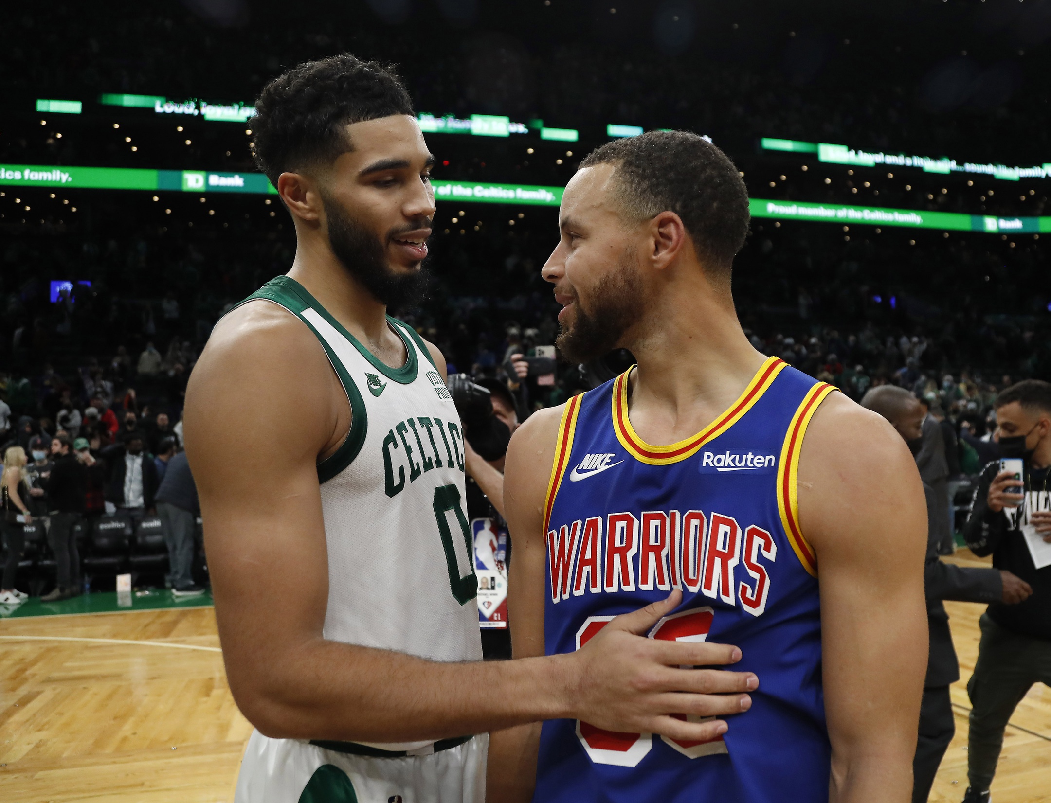 Boston Celtics forward Jayson Tatum (0) talks with Golden State Warriors guard Stephen Curry (30) after their game at TD Garden.