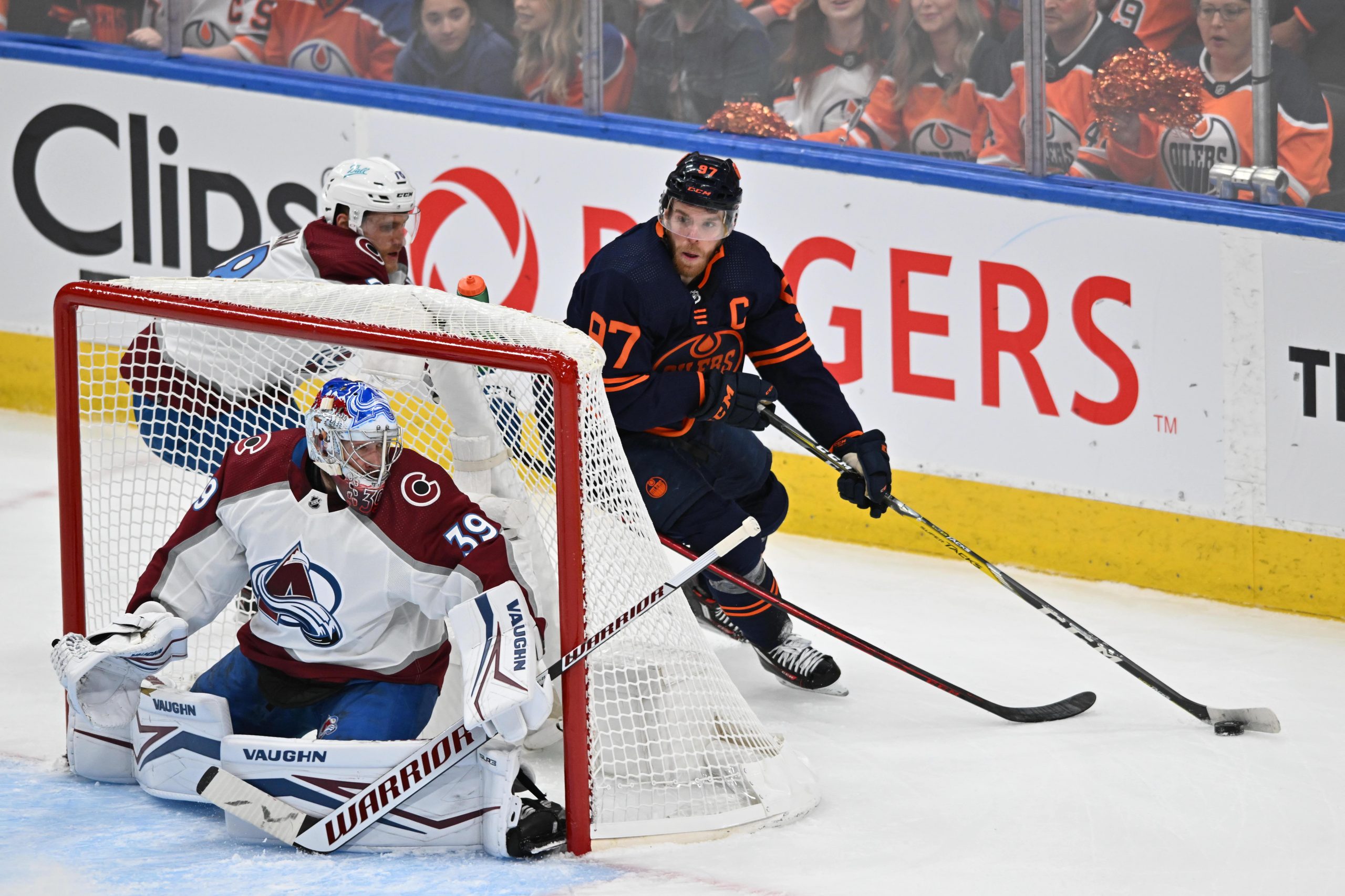 Connor McDavid skates around the net against the Avalanche
