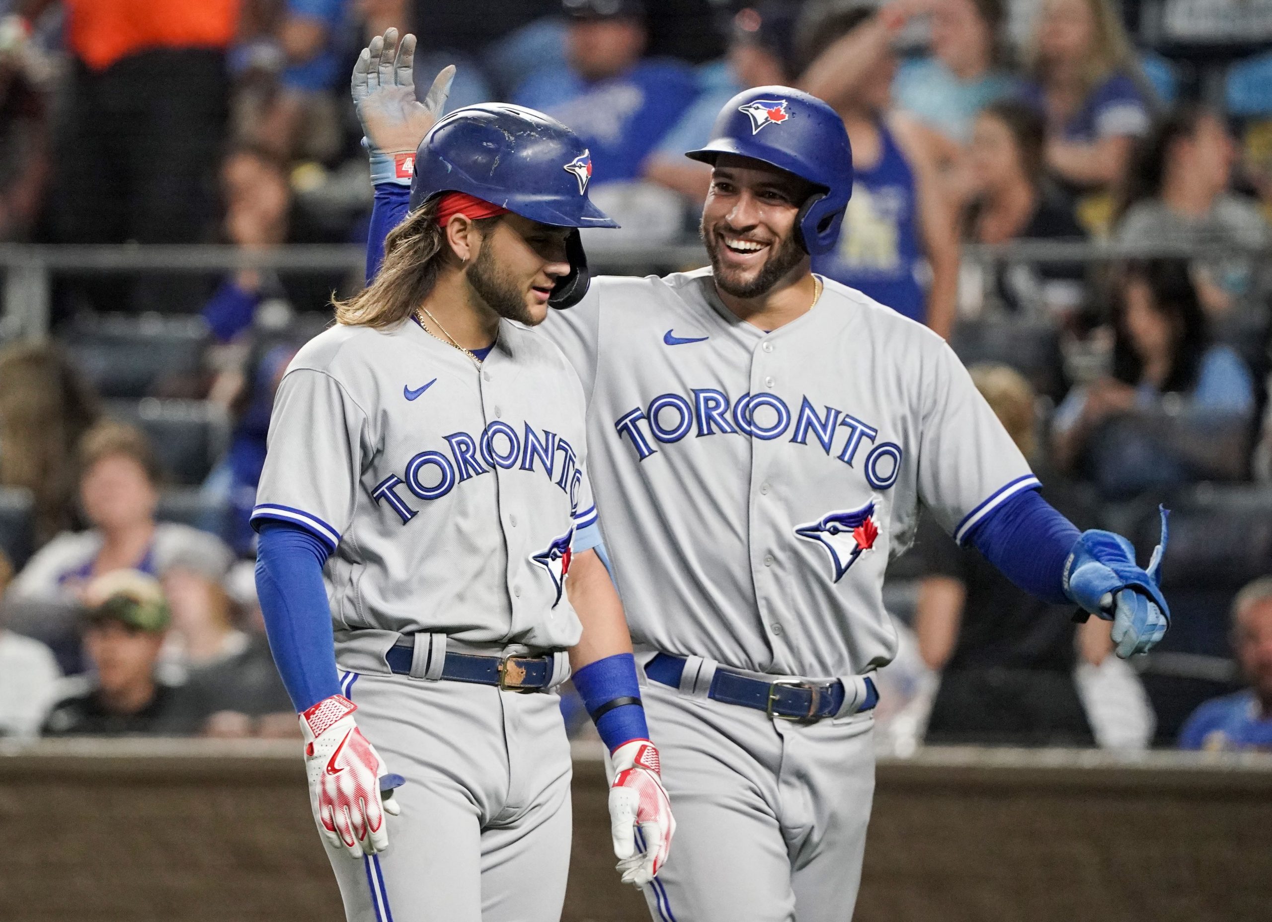 Toronto Blue Jays center fielder George Springer (4) celebrates with shortstop Bo Bichette (11) after Bichette s two-run home run against the Kansas City Royals in the fourth inning at Kauffman Stadium.