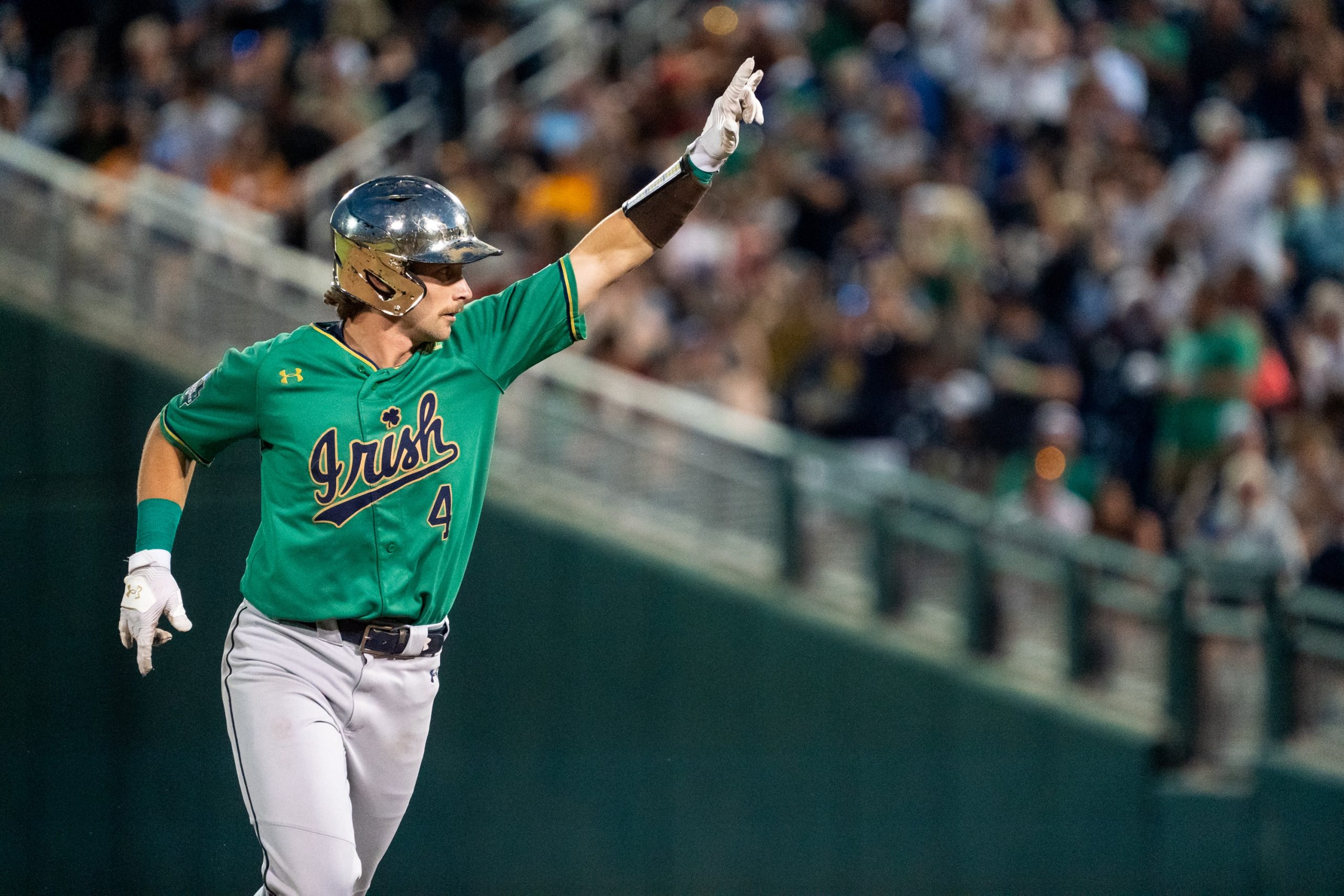 Notre Dame first baseman Carter Putz (4) gestures to the crowd after hitting a home run during the ninth inning at Charles Schwab Field