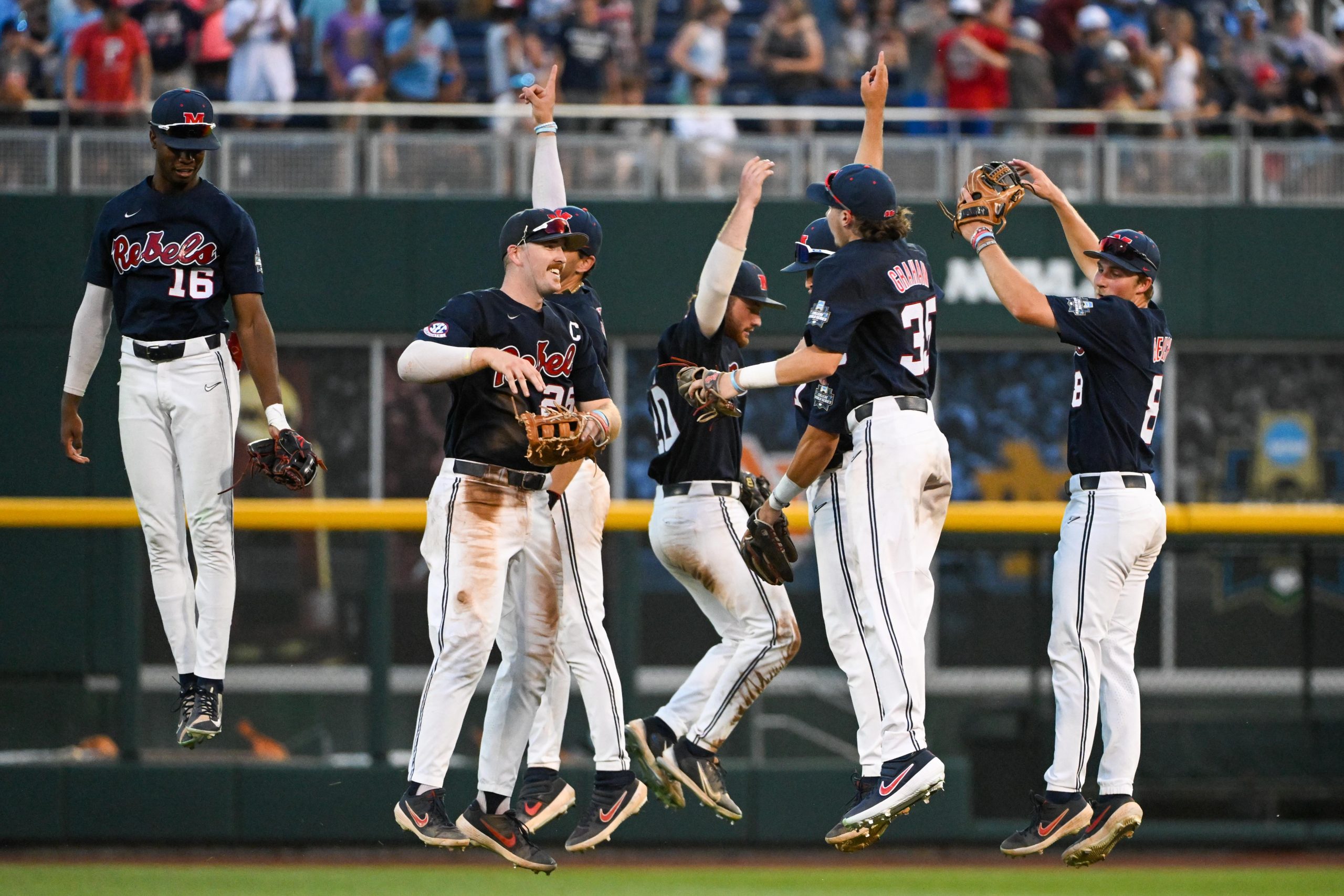 The Ole Miss Rebels celebrate after defeating the Auburn Tigers at Charles Schwab Field.
