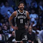 Brooklyn Nets guard Kyrie Irving (11) yells up court to teammates during the second half against the Cleveland Cavaliers at Barclays Center.