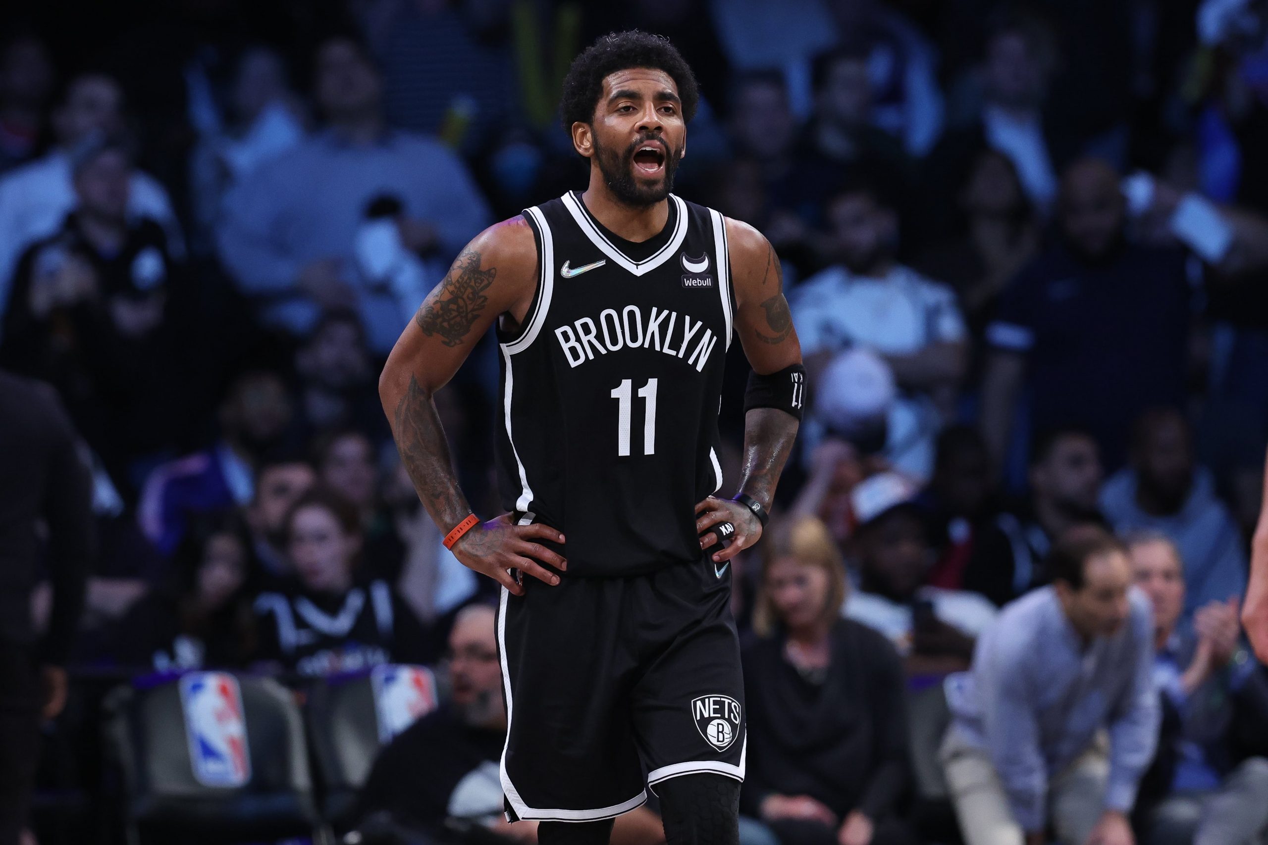 Brooklyn Nets guard Kyrie Irving (11) yells up court to teammates during the second half against the Cleveland Cavaliers at Barclays Center.