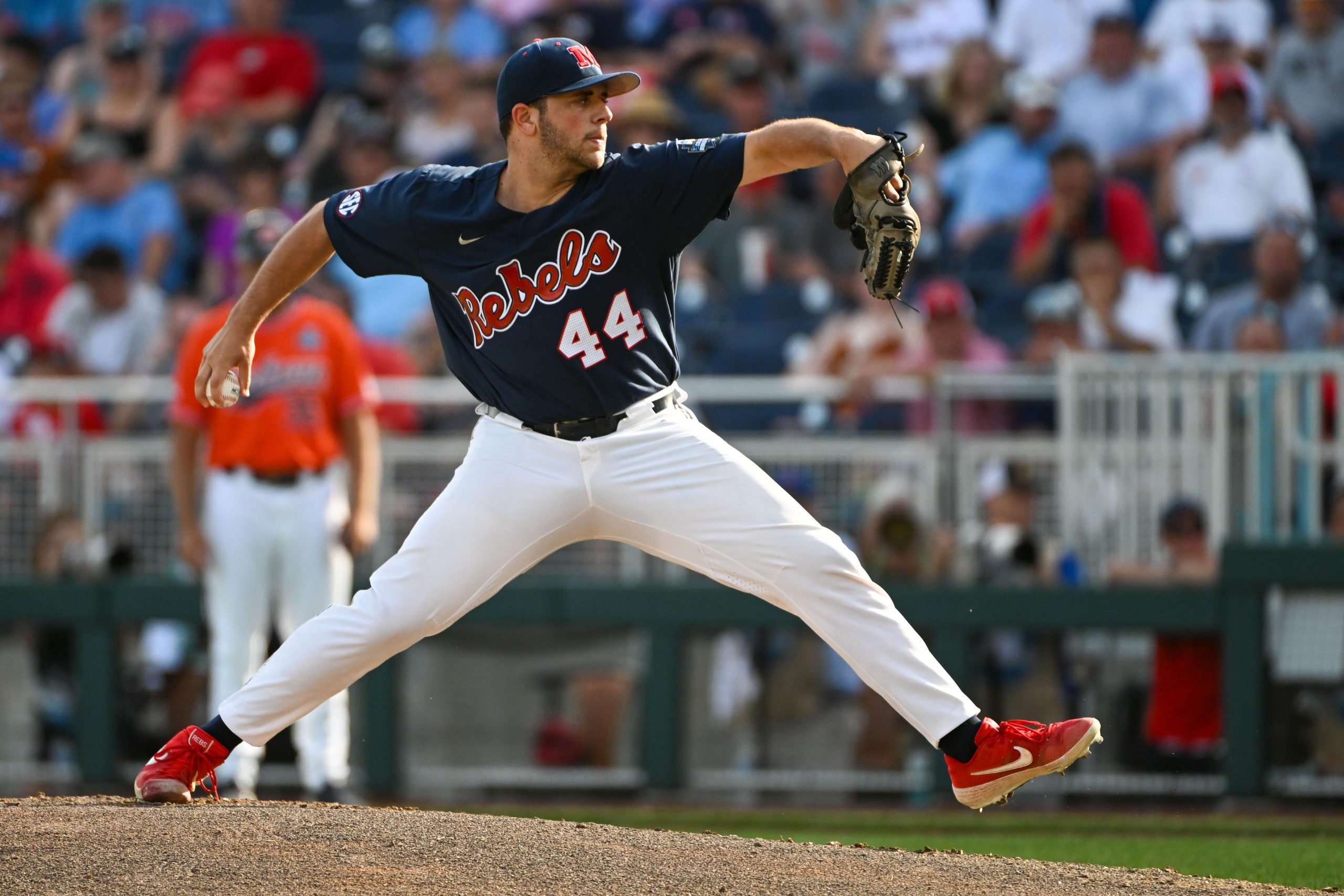 Ole Miss Rebels starting pitcher Dylan DeLucia (44) throws in the first inning against the Auburn Tigers at Charles Schwab Field.