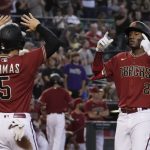 Arizona Diamondbacks third baseman Geraldo Perdomo celebrates with Alek Thomas (5) after hitting a two run home run against the Cincinnati Reds in the second inning at Chase Field.