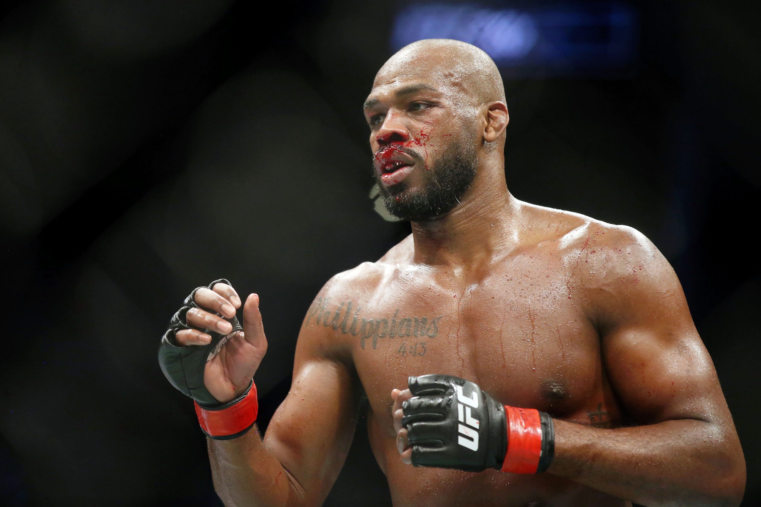 Feb 8, 2020; Houston, Texas, USA; Jon Jones (red gloves) fights Dominick Reyes (not pictured) during UFC 247 at Toyota Center.