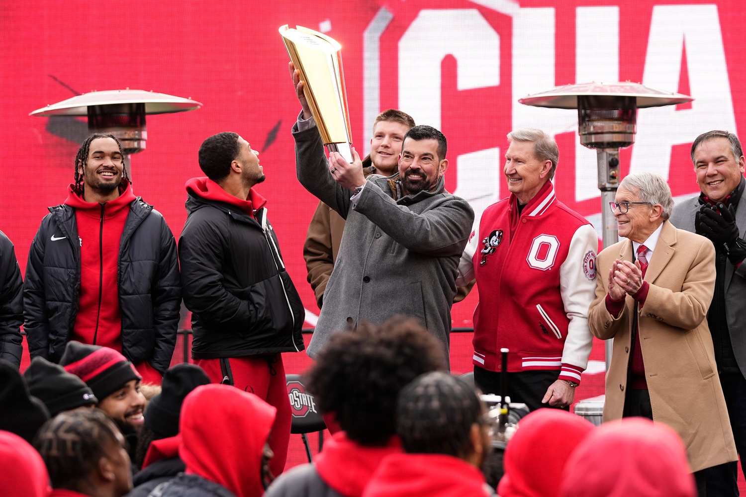 Ohio State Buckeyes head coach Ryan Day hoists the College Football Playoff trophy during the Ohio State Buckeyes National Championship celebration at Ohio Stadium in Columbus on Jan. 26, 2025