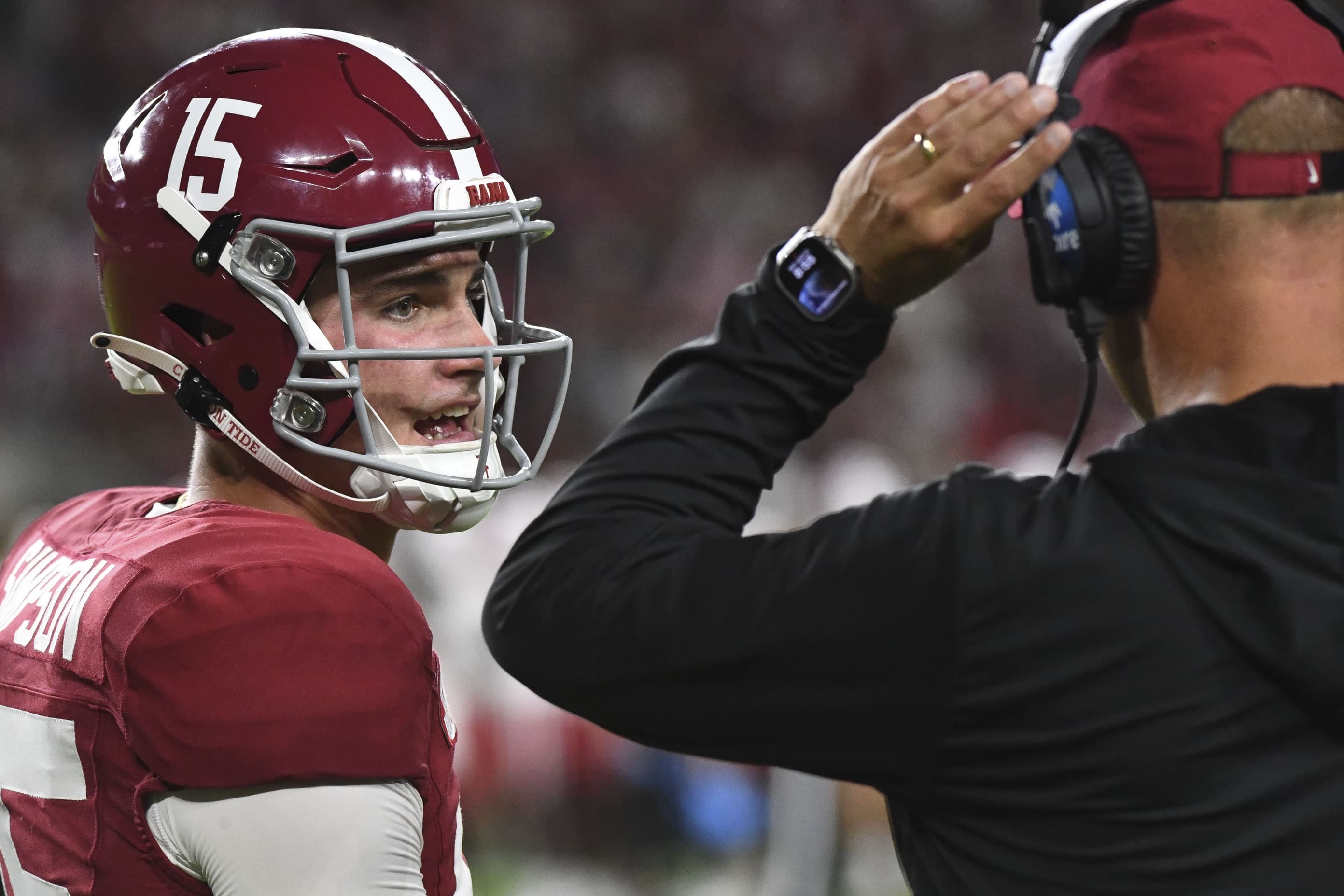 Alabama Crimson Tide quarterback Ty Simpson (15) talks with Alabama Crimson Tide head coach Kalen DeBoer at Bryant-Denny Stadium during the game between the Alabama Crimson Tide and the Western Kentucky Hilltoppers.